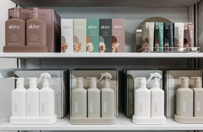Close up of beauty products on the shelf at Journey & Co.