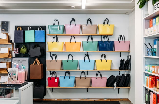 Colourful bags on a wall at Journey & Co.