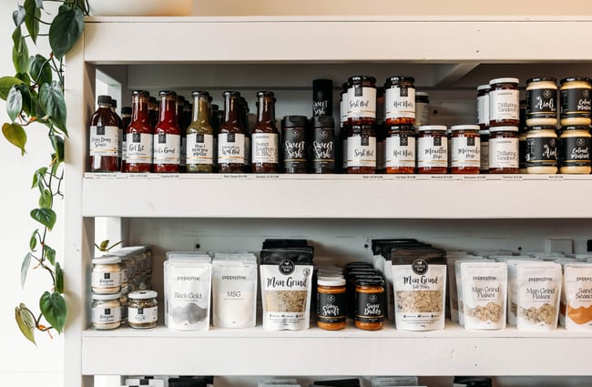Kiwi brand Pepper & Me food products on shelves at Journey & Co.