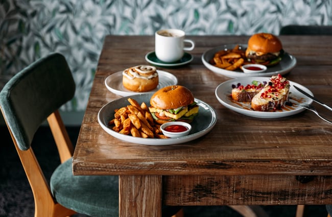 Plates of food dishes on a table at Kōwhai Eatery.