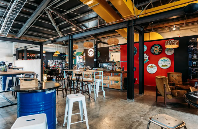 The dining area inside an industrial-style restaurant.