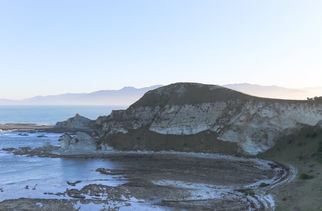 Sandy bay with cliffs on Kaikōura Peninsula Walkway, Kaikōura.