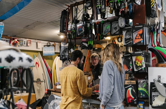 Customers chatting to Wayne, the owner of Kaikōura Surf Company.