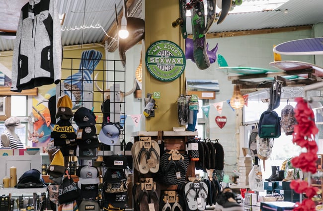 View of hats and sandals on display at Kaikōura Surf Company.