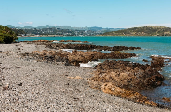 Big clay rocks covering the waterside at Karehana Bay.