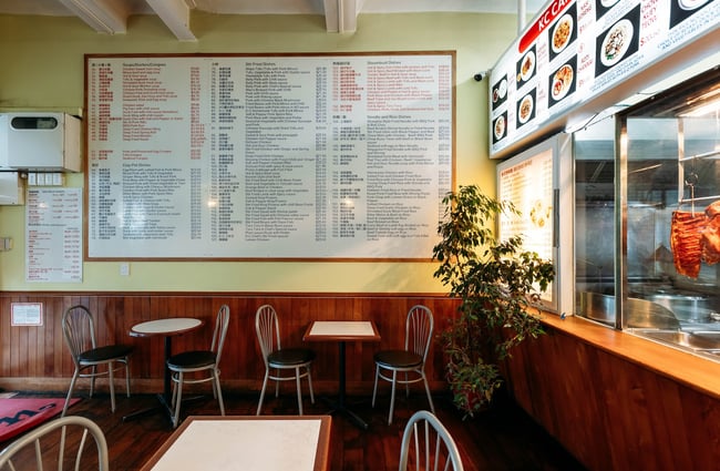 The large menu on the wall at KC Cafe.