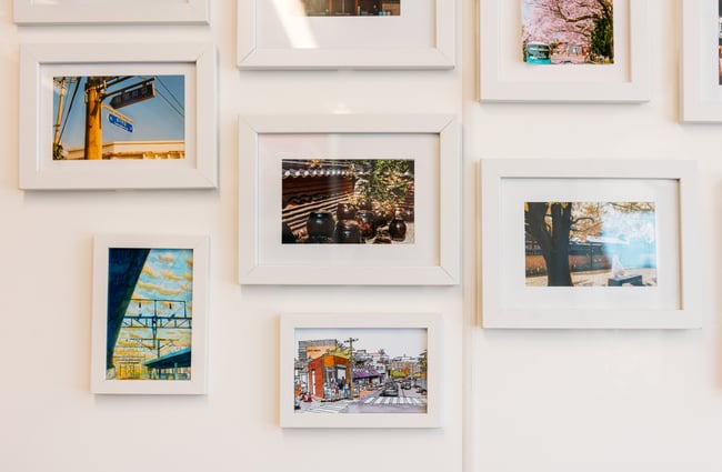 Framed works of art on a wall.
