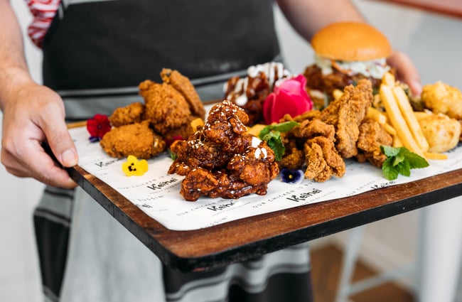 A plate of fried chickens and burgers.