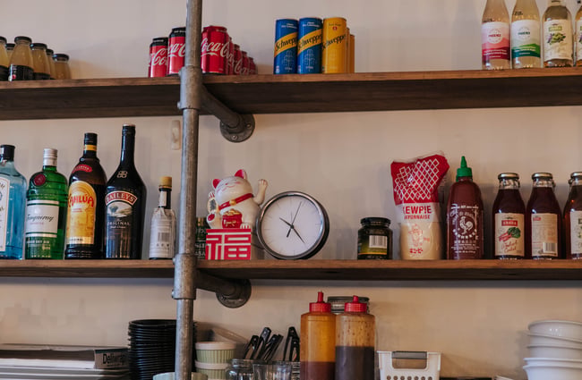 Close up of bottles and cans on the shelves at Kiki Beware.