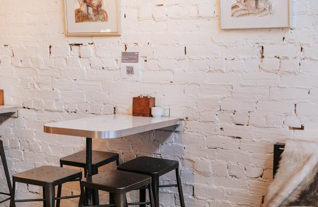 Table and chairs inside Kiki Beware.