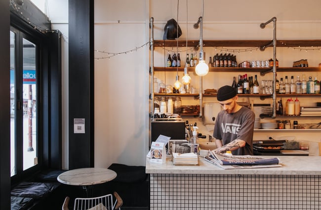 A staff member working behind the counter.