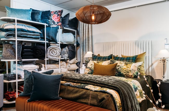 Bed display and cushion rack at King & Teppett.