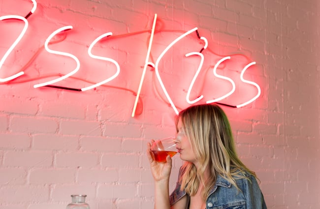 A woman drinking.