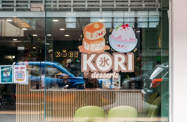 Colourful signage on the windows at Kori Desserts.
