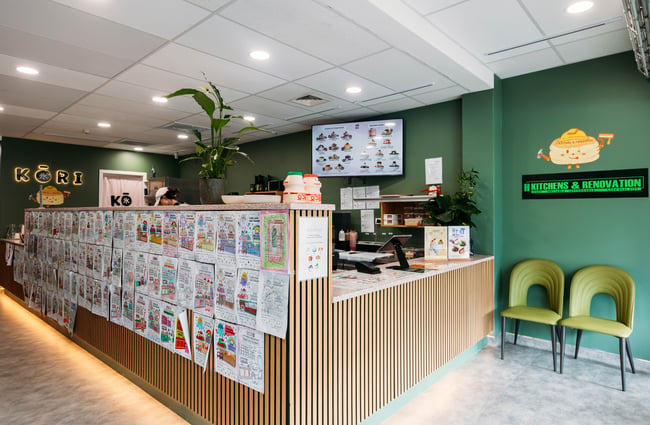 Front counter and colouring in wall at Kori Desserts.