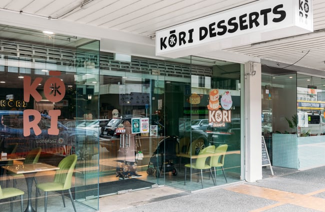 Glass frontage and front entrance with signage of Kori Desserts.