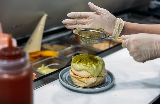 Matcha dessert being prepared in the kitchen at Kori Desserts.