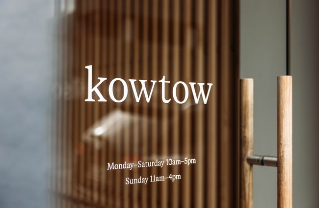 Kowtow window signage.