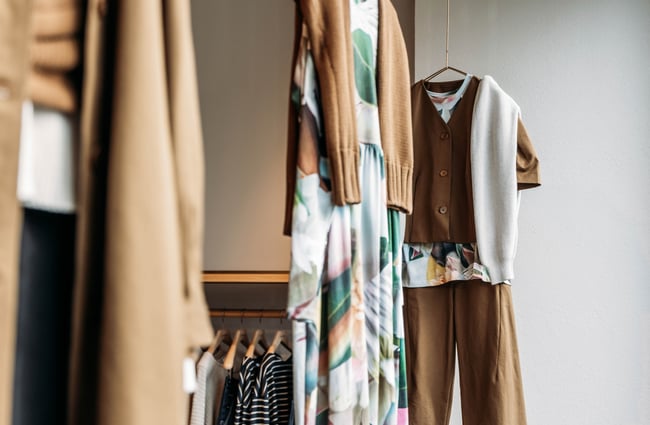 Close up of clothing hanging up in Kowtow.