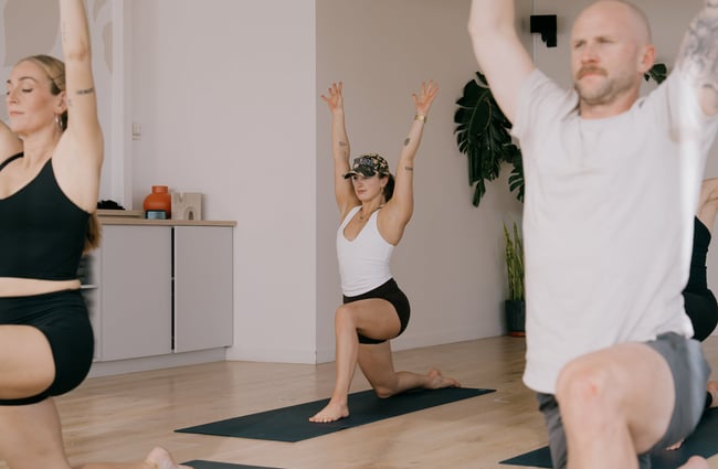 Student doing long lunge during yoga class at Kula Studio in Christchurch
