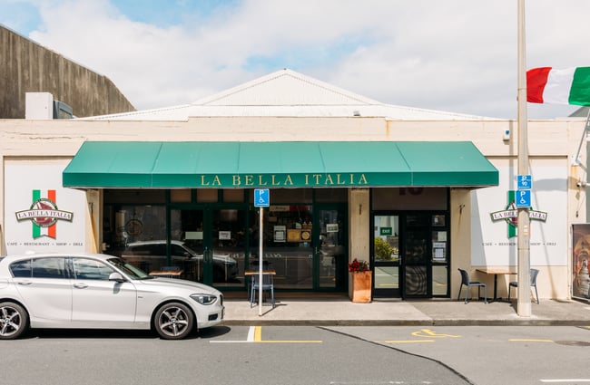 The exterior of La Bella Italia on a sunny day.