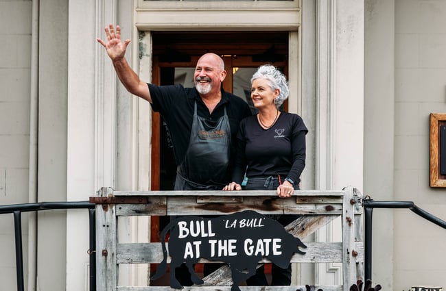 A man and woman standing outside La Bull in Rangitikei.
