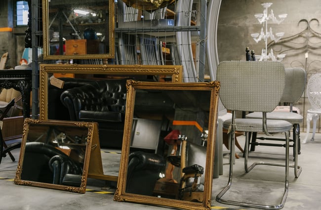 Three gold framed mirrors on display at La Voute, Christchurch.