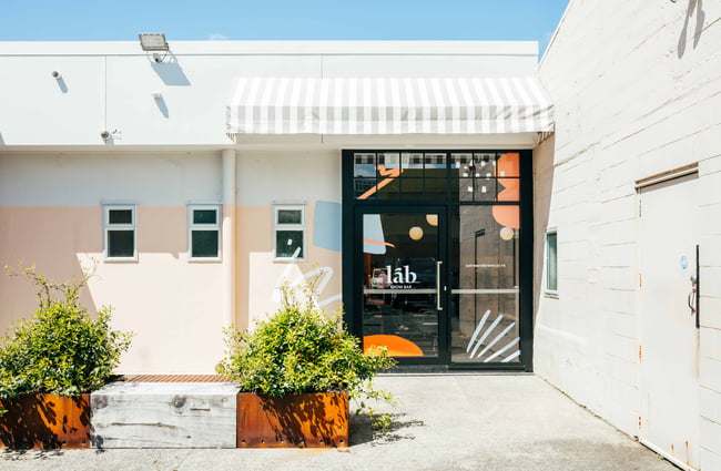 The bright and colourful entrance to Lab Brow Bar.