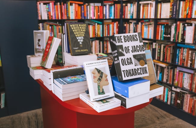 Books on display on a table at Lamplight Books, Auckland.