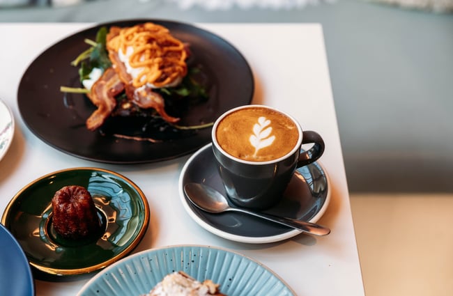 Cannele, coffee and other dishes on a table at Le Ciel.