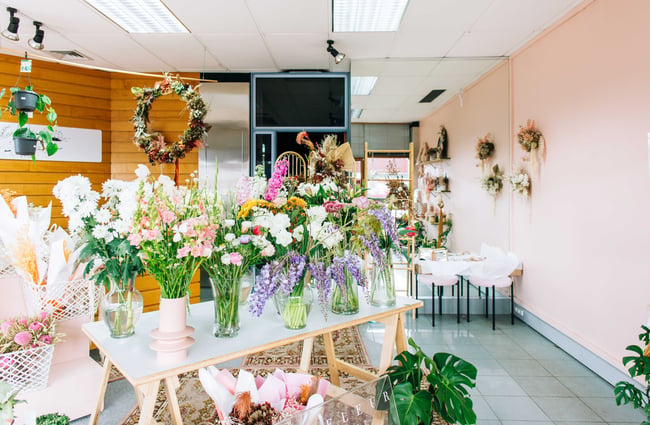 Le Fleur florist with flowers on the table.