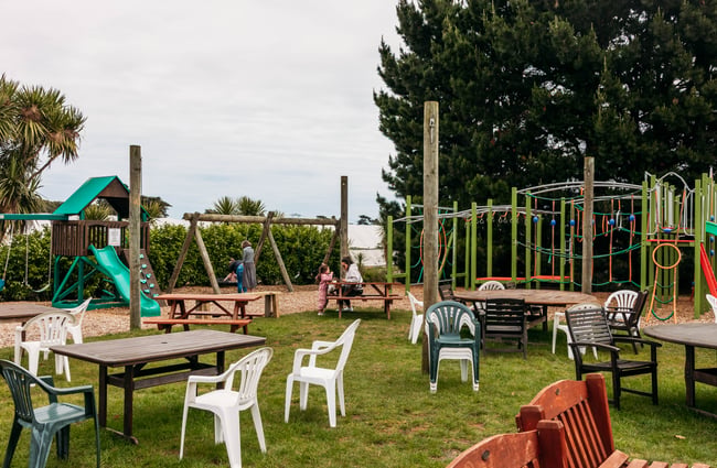 Playground and outdoor tables and chairs at Lewis Farms.