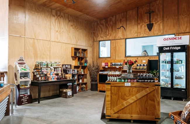 Product displays and fridges in the shop at Lewis Farms.
