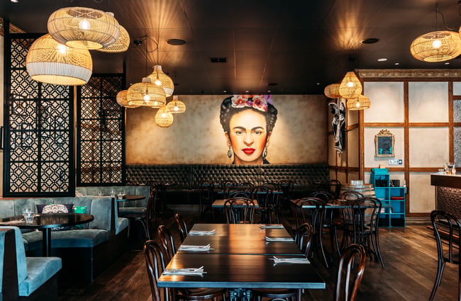 Frida Kahlo poster on the wall in the dining room of Libre.