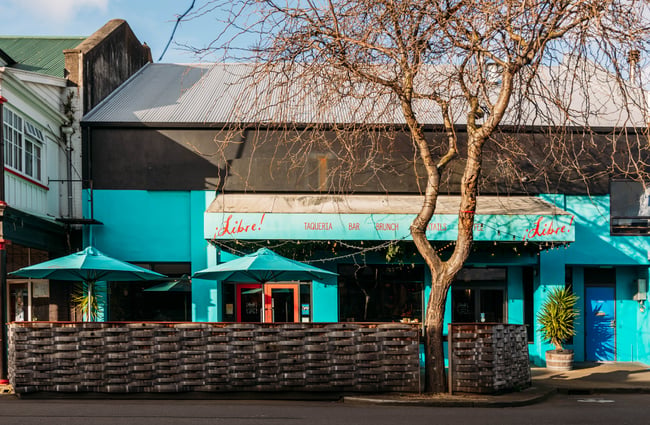 Bright blue building exterior of Libre.