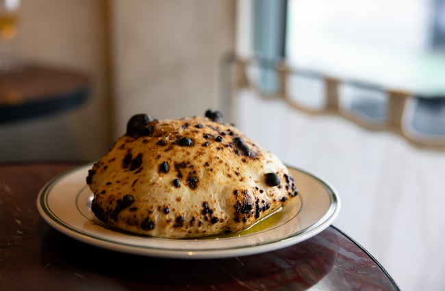 A piece of bread on a plate.