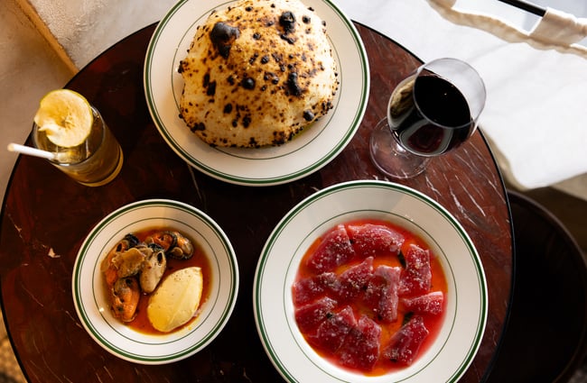 Three plates of food on a table at Lilian Auckland.