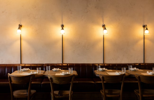 Tables and chairs inside Lilian Restaurant.