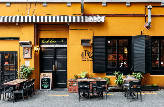 The yellow exterior of Little Beer Quarter.