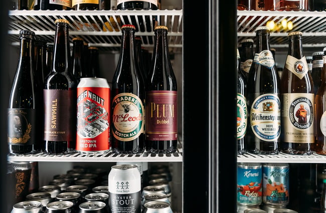 Bottled beers inside a fridge.