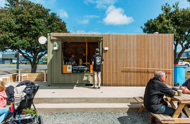 Customer ordering at the hatch of Little Green Olive.