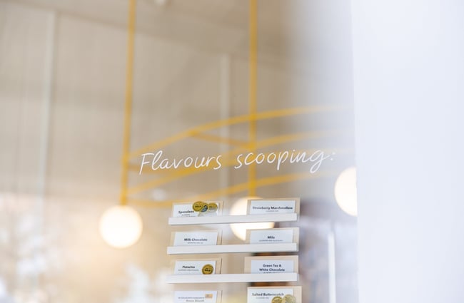 'Flavours scooping' sign on a door.