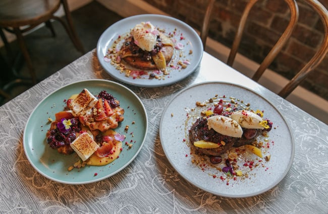Flatlay of three sweet dishes on a table at Little Pom's café, Christchurch.