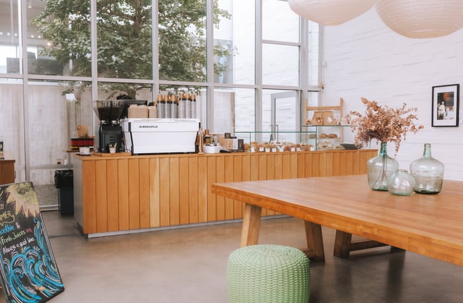Interior view of the Little Rosie space with large communal table.