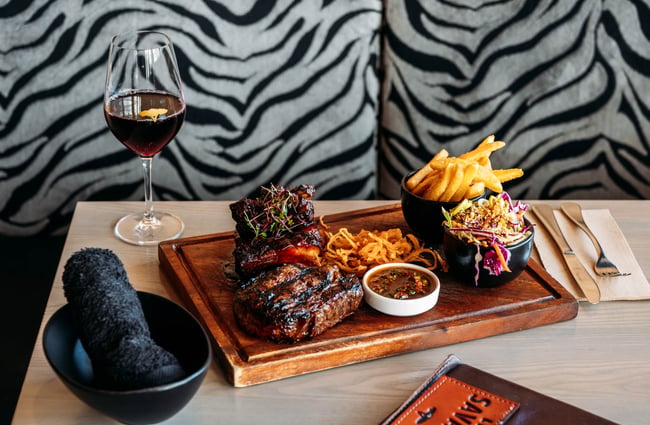 Platter and glass of wine on the table at Little Savanna.