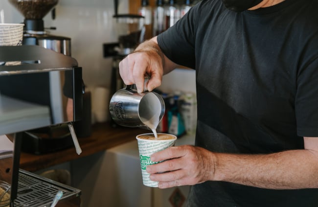 Man making a flat white takeaway coffee at Little Vintage Espresso, North Canterbury.