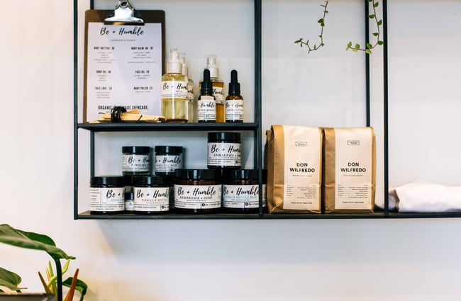 Shelves of produce and coffee beans.