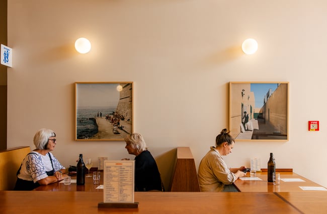 Diners at booth seating at Local Talent Taverna.