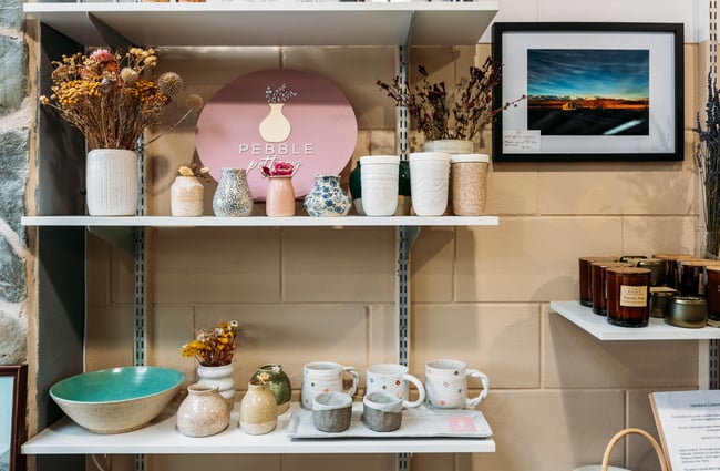 Ceramics on display on shelves.