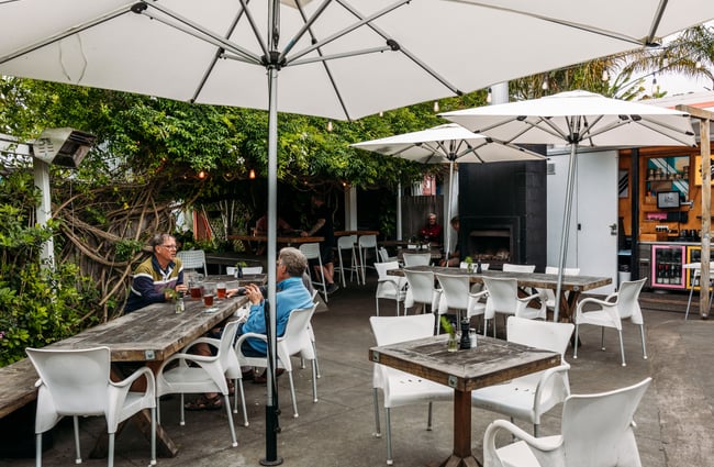 Outdoor seating area outside a cafe.